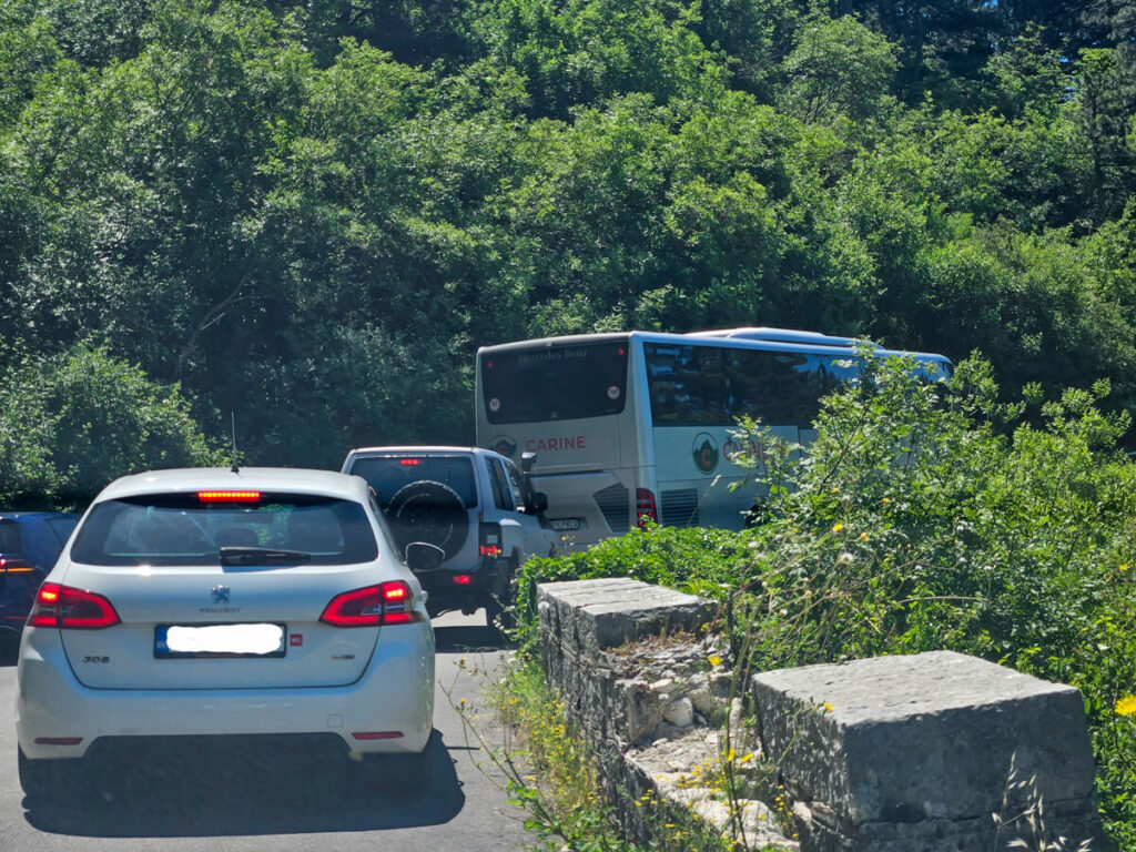 Cars stuck behind a coach that's holding up traffic on the Kotor Serpentine.