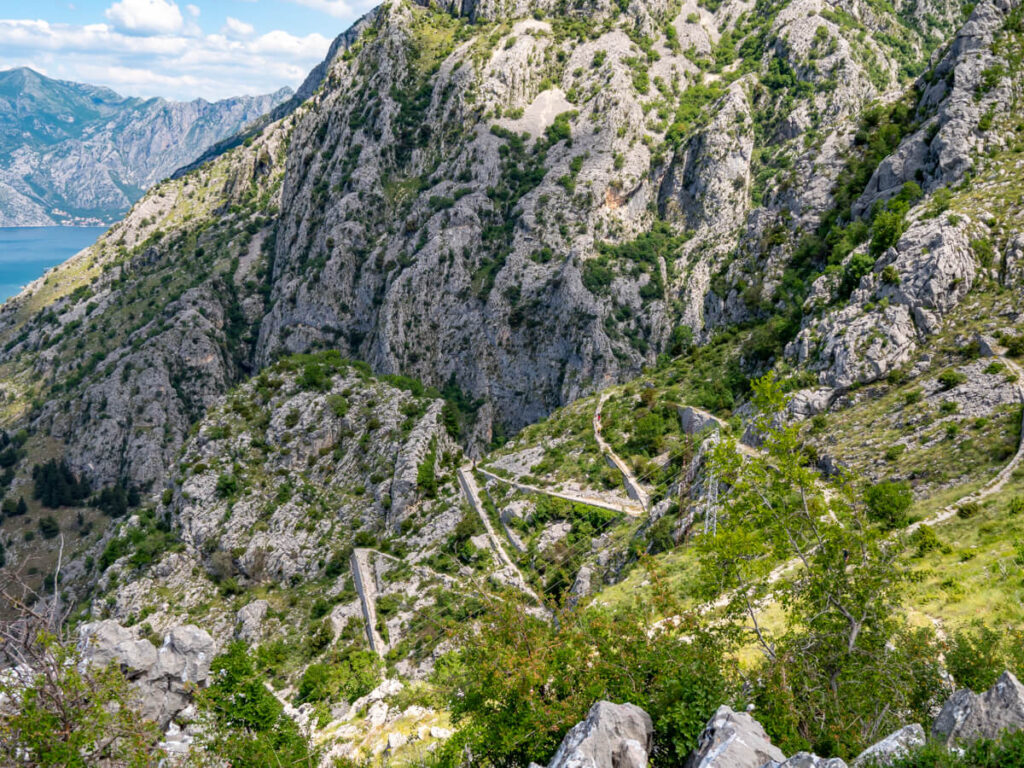 The zigzag Ladder of Kotor trail snaking up a mountainside above Kotor.