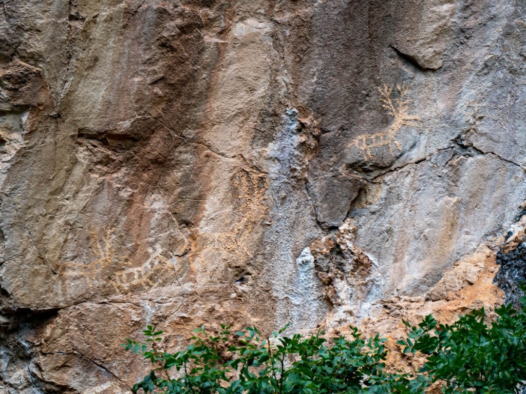 Impressively preserved prehistoric rock art carved into limestone cliffs in Lipci.