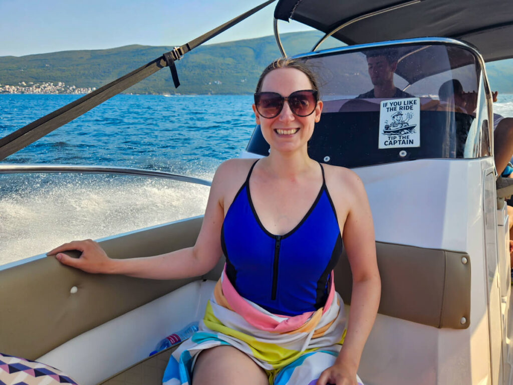 Lucy smiling on a speedboat on a Blue Cave tour.