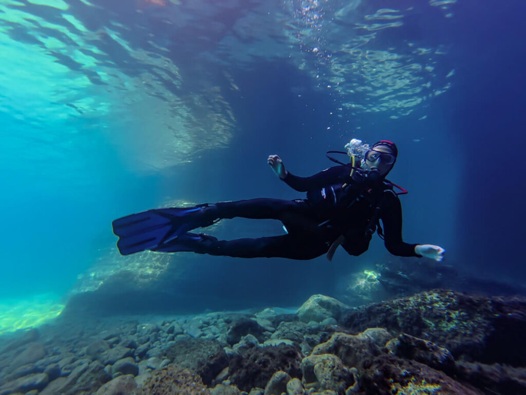 Lucy SCUBA diving in shallow water off the coast of Budva, Montenegro.