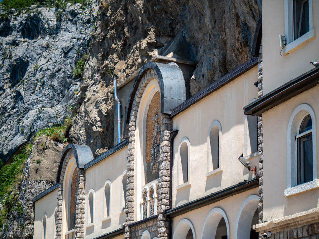 The arched façade of the Upper Monastery of Saint Basil of Ostrog.