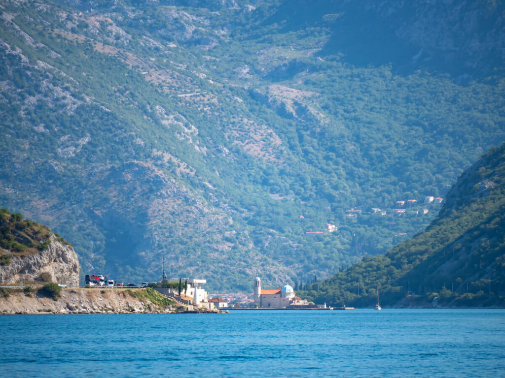 The Our Lady of the Rocks church on a small island off Perast, viewed from the Bay of Kotor Ferry.