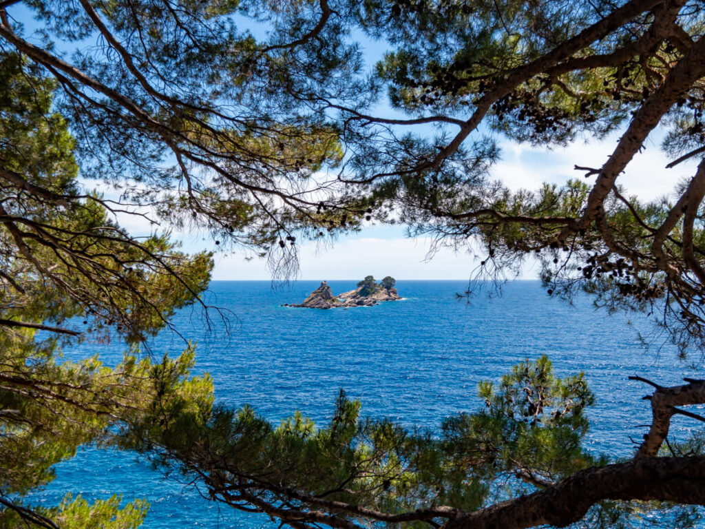 KatiÄŤ and Sveta Nedjelja Islands viewed through foliage from a coastal walk around the headland near Petrovac.