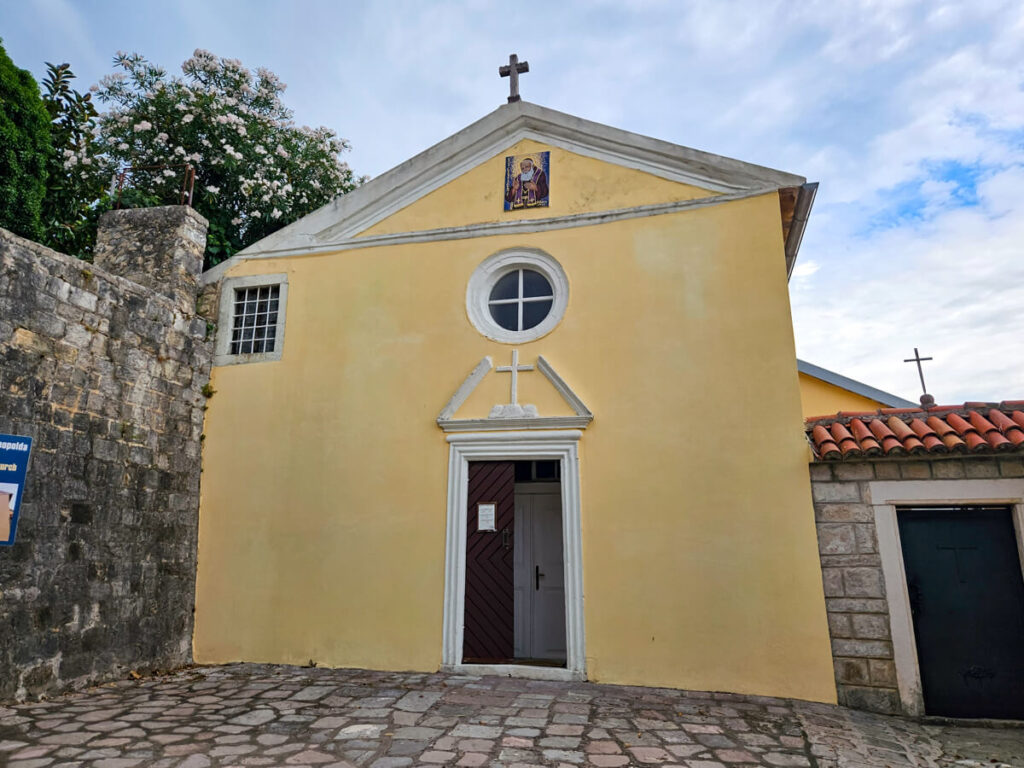 The small, simple facade of Saint Leopold Church, Herceg Novi.