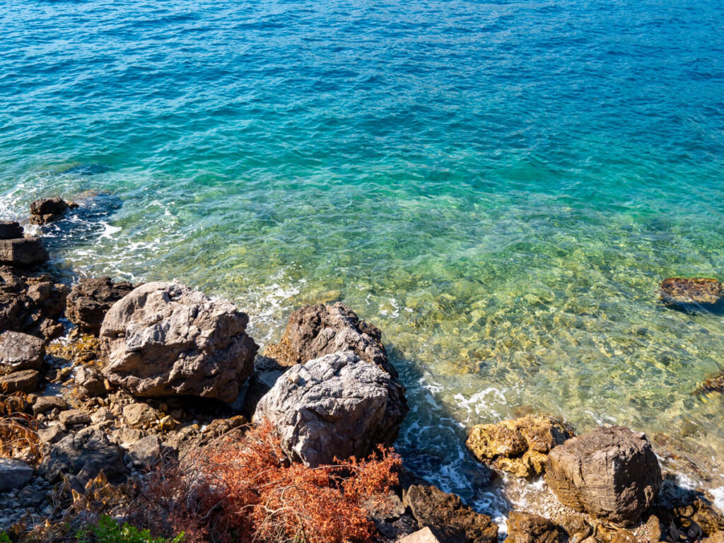 The clear Adriatic Sea on the shore of the Bay of Kotor.
