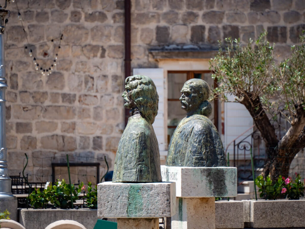 Busts of important figures in a square in Perast, Montenegro.