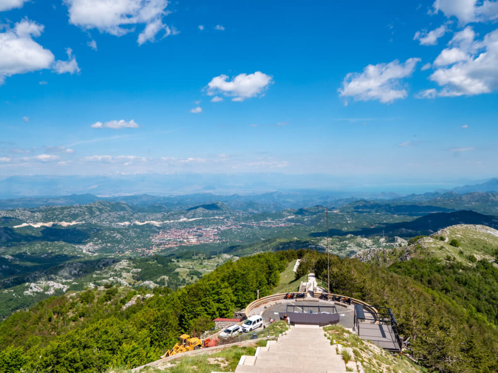 Steps leading to the entrance of the Njegoš Mausoleum Lovćen National Park, backed by an expansive view of the countryside.