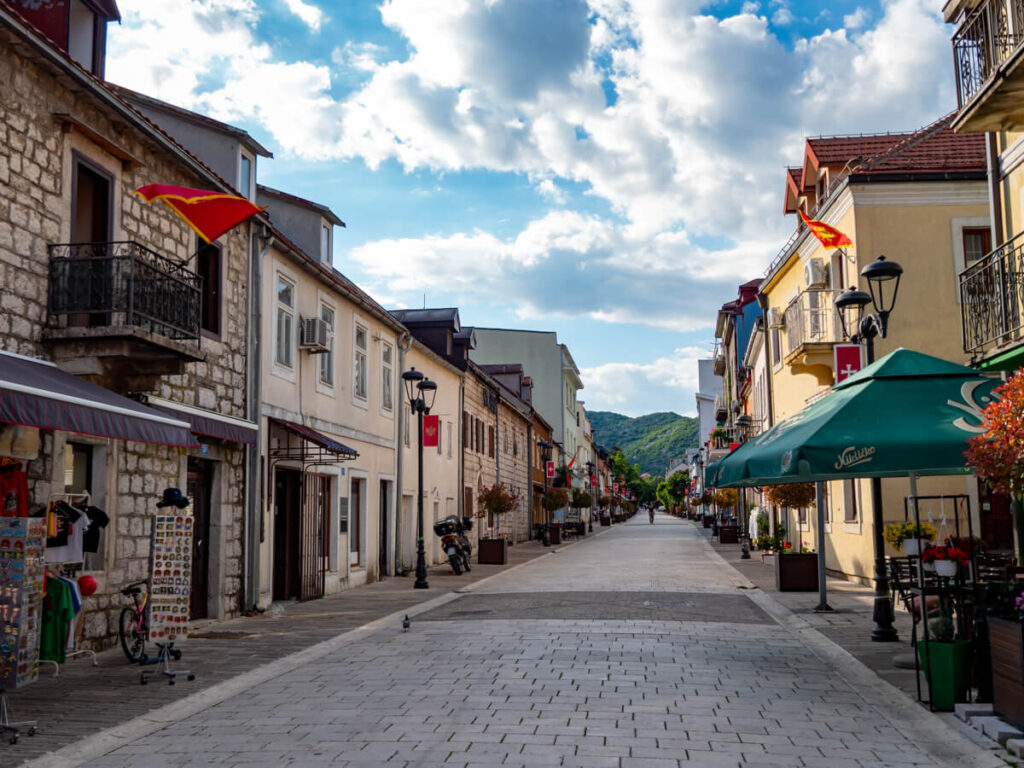 An empty street lined with historic buildings in Cetinje.