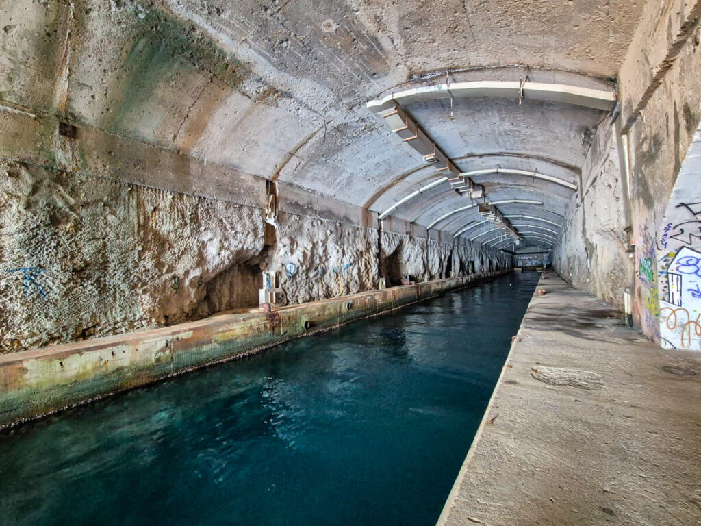 A submarine tunnel carved into a cliff on the Luštica Peninsula.