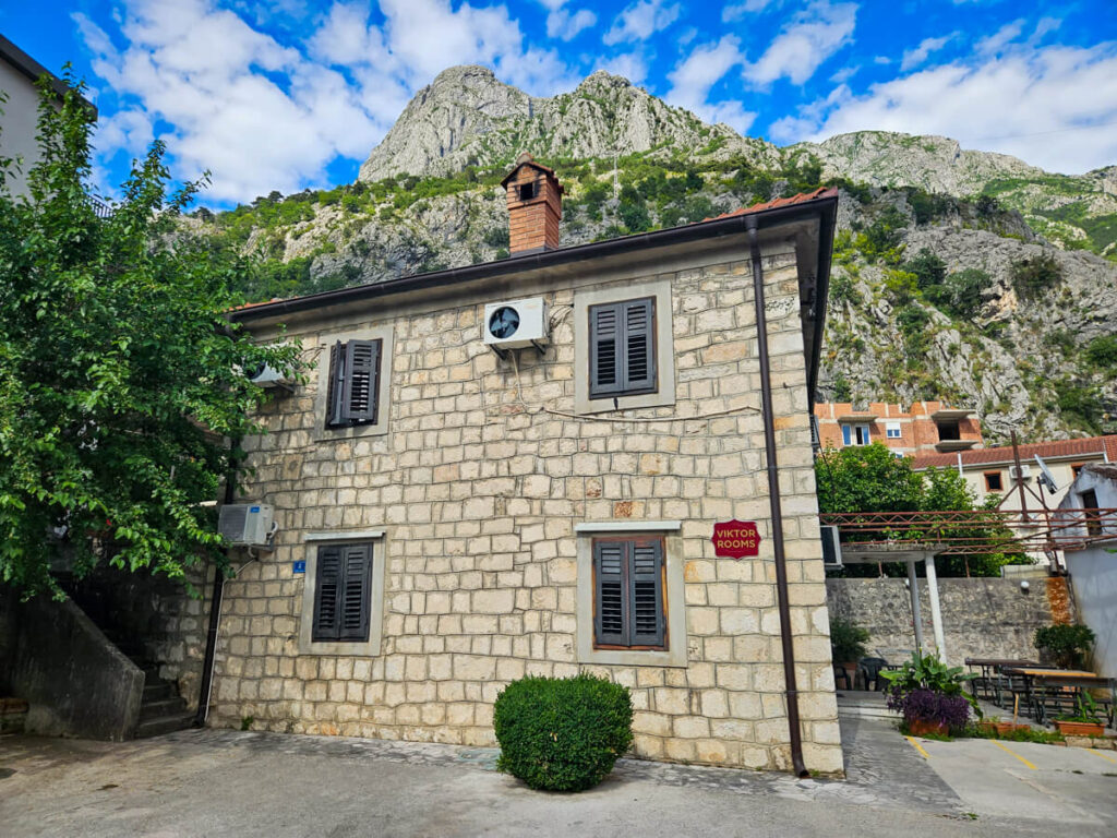 A stone building, part of Viktor's Rooms, one of the best places to stay in Kotor on a budget.