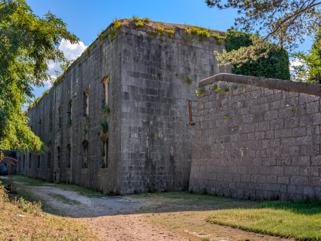 The simple stone facade of Vrmac Fortress, Kotor.