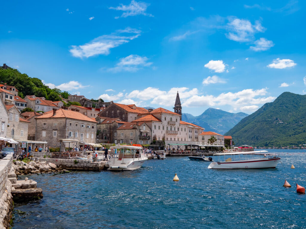 The red-roofed buildings of Perast, one of the best places to visit in the Bay of Kotor.