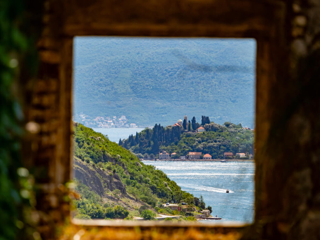 A view of the sea through an old window in a fort above Perast, Montenegro.
